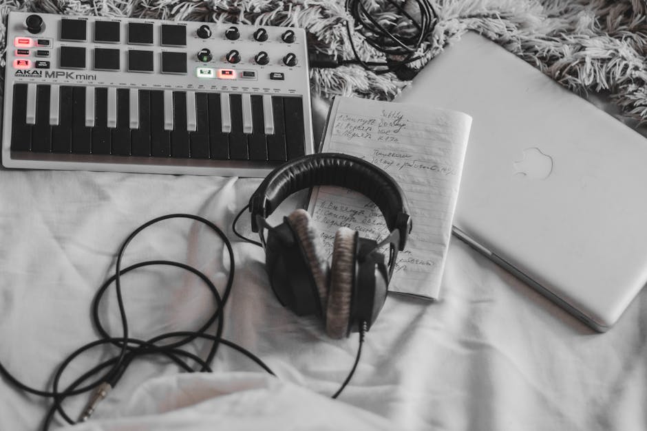 Music producer working in a home studio with headphones on
