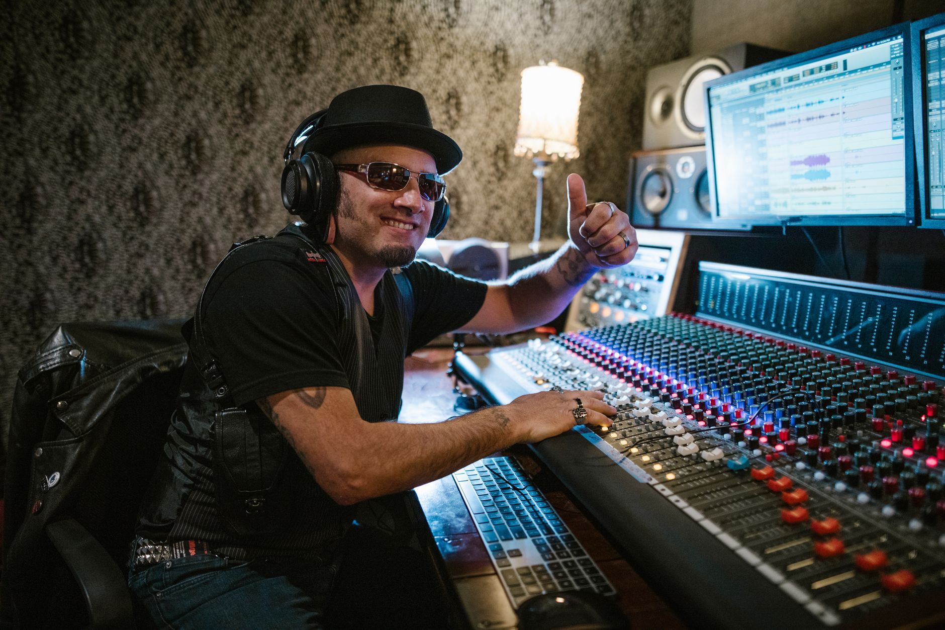 Confident music producer working in a recording studio